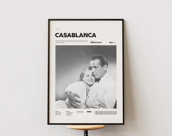 Op de afbeelding: Zwart-witte filmposter voor de film Casablanca, met Humphrey Bogart en Ingrid Bergman. De poster heeft de titel "Casablanca" in vetgedrukte witte letters en de naam van de regisseur, "Michael Curtiz", in kleinere witte letters.