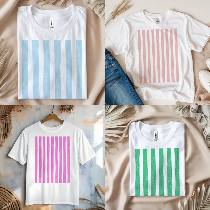 Puede incluir: Cuatro camisetas blancas con dise&ntilde;os de rayas verticales en azul, rosa, morado y verde. Las camisas se muestran sobre un fondo neutro con elementos decorativos. Las camisetas son de manga corta y tienen cuello redondo.