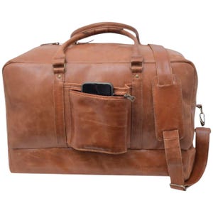 Genuine leather duffle bag with smartphone placed inside to show spacious interior