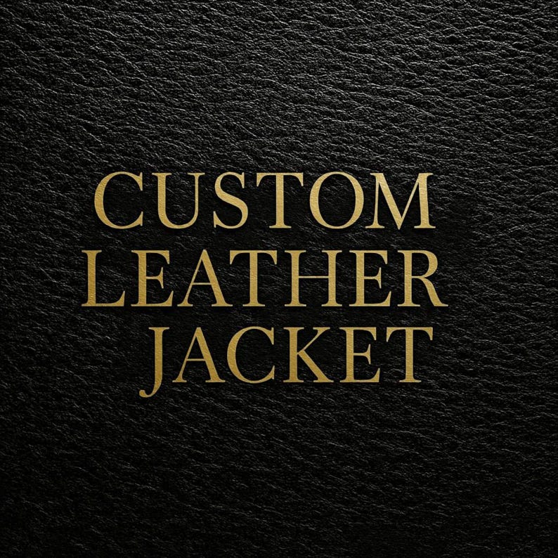 May include: Close-up of a black leather texture with the words "CUSTOM LEATHER JACKET" in gold. The text is in a bold serif font and is centrally positioned. The leather has a subtle, textured appearance.