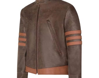 May include: A brown leather jacket with a stand-up collar and a zip-up front. The jacket has two diagonal zip pockets and three brown stripes on each sleeve. The collar and sleeve cuffs have a lighter brown trim.