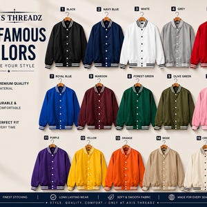 May include: A collection of 15 varsity jackets from Axis Threadz in black, navy blue, white, grey, red, royal blue, maroon, forest green, olive green, pink, purple, yellow, orange, beige, and cream, each featuring white striped trim and buttons.