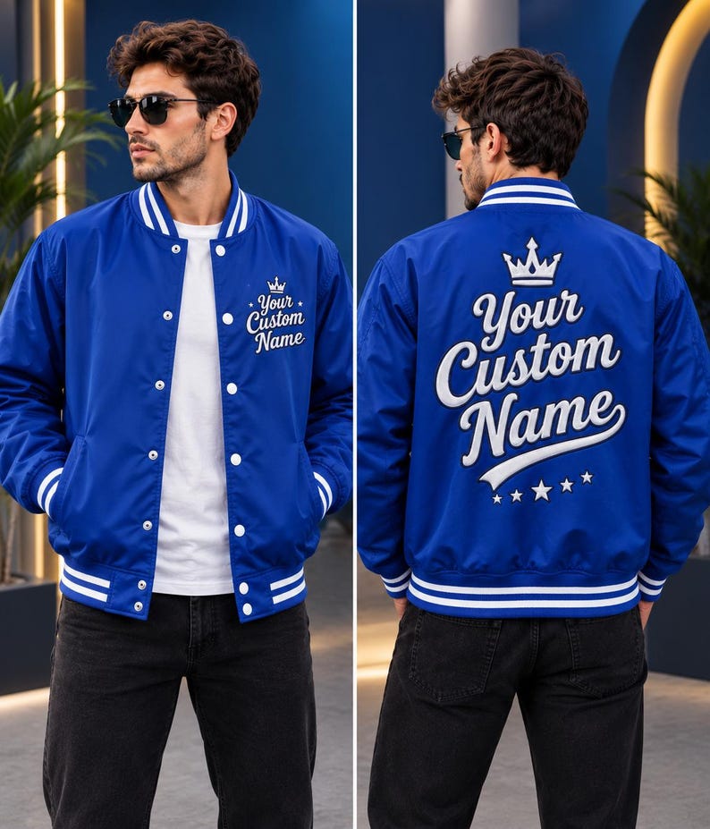 May include: A royal blue varsity jacket featuring white striped ribbed trim on the collar, cuffs, and hem. The front displays the text Your Custom Name with a crown icon. The back features the same text in large white script with a crown and stars.