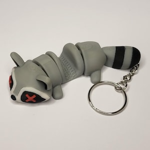 Splat Raccoon Keyring – Funny Animal Keychain | Flat Raccoon Bag Charm | Unique Accessory for Keys, Backpacks, or Zippers