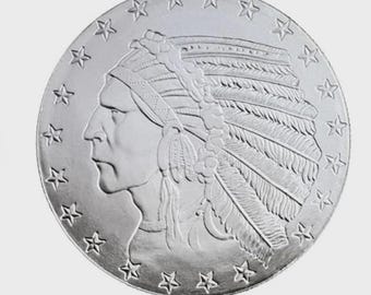 May include: A silver coin featuring a profile of a Native American chief wearing a feathered headdress. The coin's edge is adorned with stars. The coin has a detailed relief and a shiny finish.
