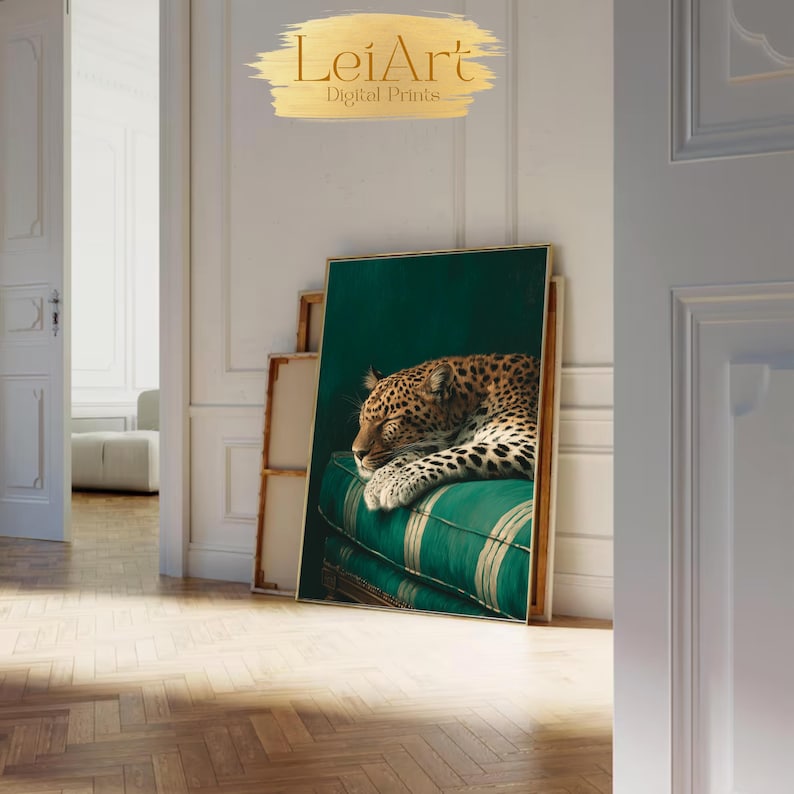 May include: A framed digital print featuring a sleeping leopard on a green and white striped cushion. The artwork is displayed in a room with a wooden floor and white walls. The text "LeiArt Digital Prints" is visible at the top.