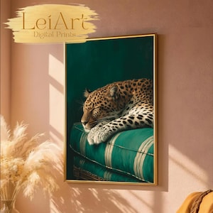 May include: A framed art print featuring a sleeping leopard on a green striped cushion. The leopard has a spotted coat and is resting its head. The artwork is framed in a gold-colored frame. The text "LeiArt Digital Prints" is in the upper left corner.