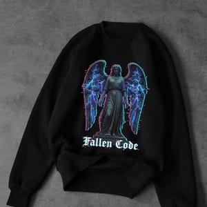 May include: Black sweatshirt featuring a graphic of an angel statue with electric blue and purple wings and lightning. The text "Fallen Code" is below the angel in a gothic font. The sweatshirt has a crew neck and long sleeves.
