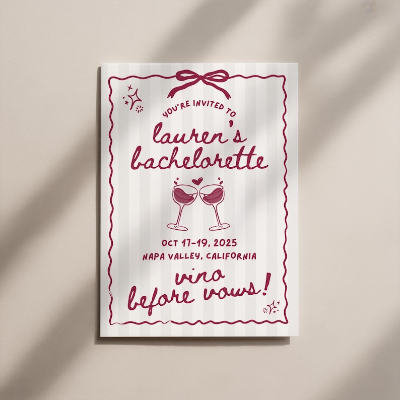 May include: A rectangular invitation with a burgundy border and text. The invitation reads "You're invited to lauren's bachelorette" with the dates "Oct 17-19, 2025" and "Napa Valley, California." The phrase "vino before vows!" is also included.