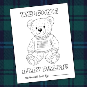 May include: Black and white illustration of a teddy bear wearing a sweater with an American flag design. The text "WELCOME BABY RALPH!" is at the top and bottom of the image, with a line for a signature.