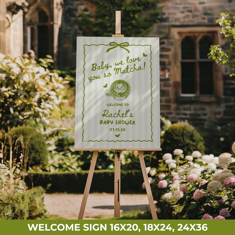 May include: A welcome sign on a wooden easel with the text "Baby, we love you so Matcha!" and "Welcome to Rachel's Baby Shower 03.15.26". The sign is white with green accents and a matcha latte graphic.