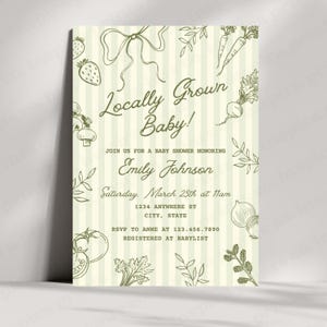 May include: A baby shower invitation with a cream background and vertical stripes. The text "Locally Grown Baby!" is displayed in a whimsical font. The invitation includes illustrations of vegetables and fruits, such as carrots, strawberries, and onions.