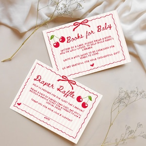 May include: Two pink and white striped cards with red cherry illustrations and text. The top card says "Books for Baby" and asks guests to bring a book for the baby's library. The bottom card says "Diaper Raffle" and asks guests to bring a pack of nappies for a chance to win a prize.