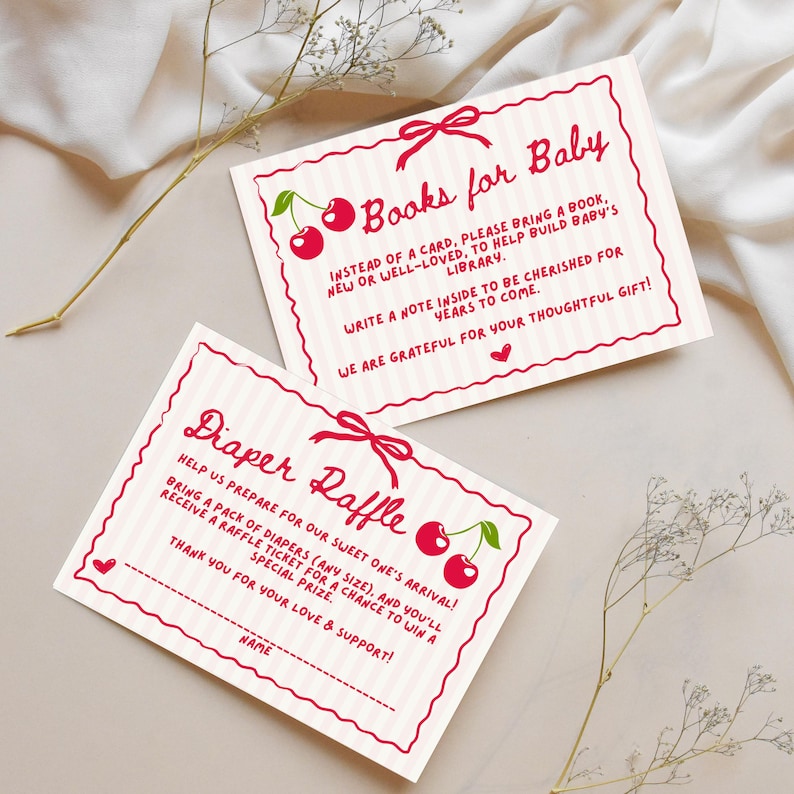 May include: Two pink and white striped cards with red cherry illustrations and text. The top card says "Books for Baby" and asks guests to bring a book for the baby's library. The bottom card says "Diaper Raffle" and asks guests to bring a pack of nappies for a chance to win a prize.