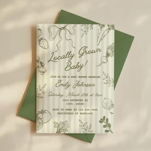 May include: A baby shower invitation with a green envelope. The invitation has a striped background with illustrations of vegetables and the text "Locally Grown Baby!" It includes details for Emily Johnson's baby shower.