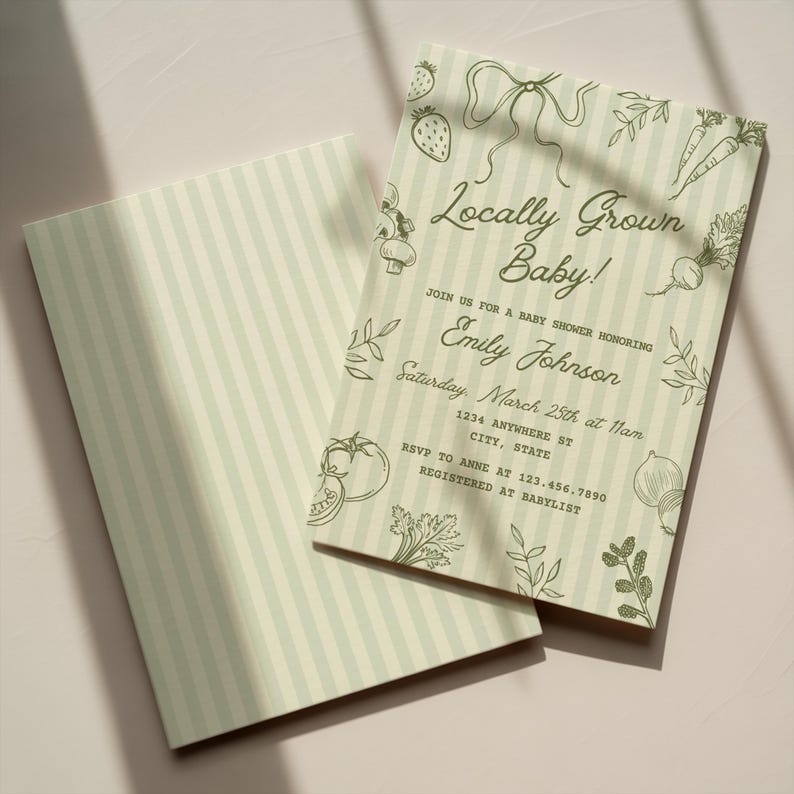 May include: Baby shower invitations with a light green and white striped background. The invitations feature the text "Locally Grown Baby!" and include illustrations of vegetables and fruits. The invitation is for Emily Johnson.