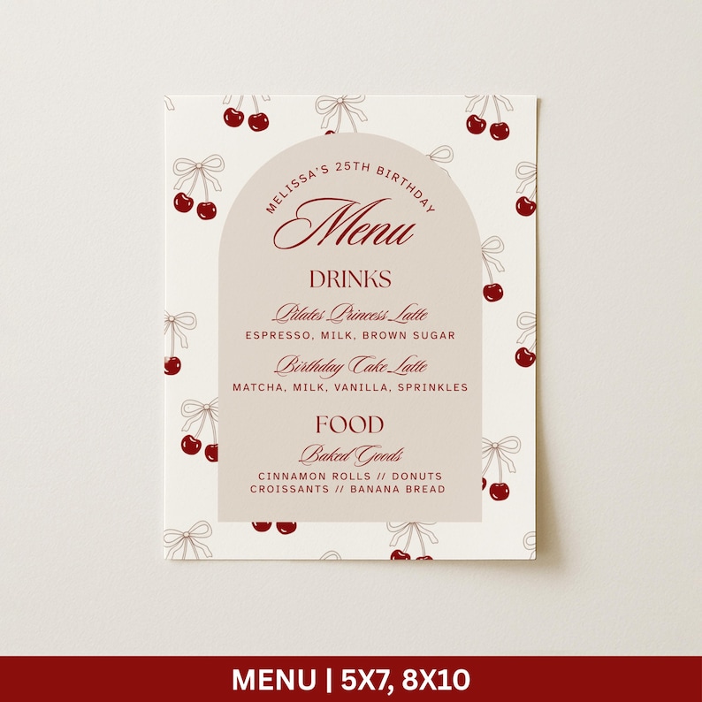 May include: A menu card with a cream background and a pattern of cherries and bows. The menu features a central arch with the word "Menu" in a script font. The menu lists drinks like Pilates Princess Latte and Birthday Cake Latte, and food like baked goods.