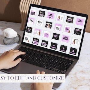 May include: A laptop displaying a presentation with pink and black slides. The text "EASY TO EDIT AND CUSTOMIZE" is at the bottom of the screen. The laptop is on a marble surface with decorative stones and a wooden accent in the background.