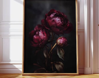 May include: A rectangular wall art print in a thin gold frame featuring a dark, moody botanical composition of deep burgundy and dark red peony flowers with green leaves against a black background, displayed in a bright, white-walled room.