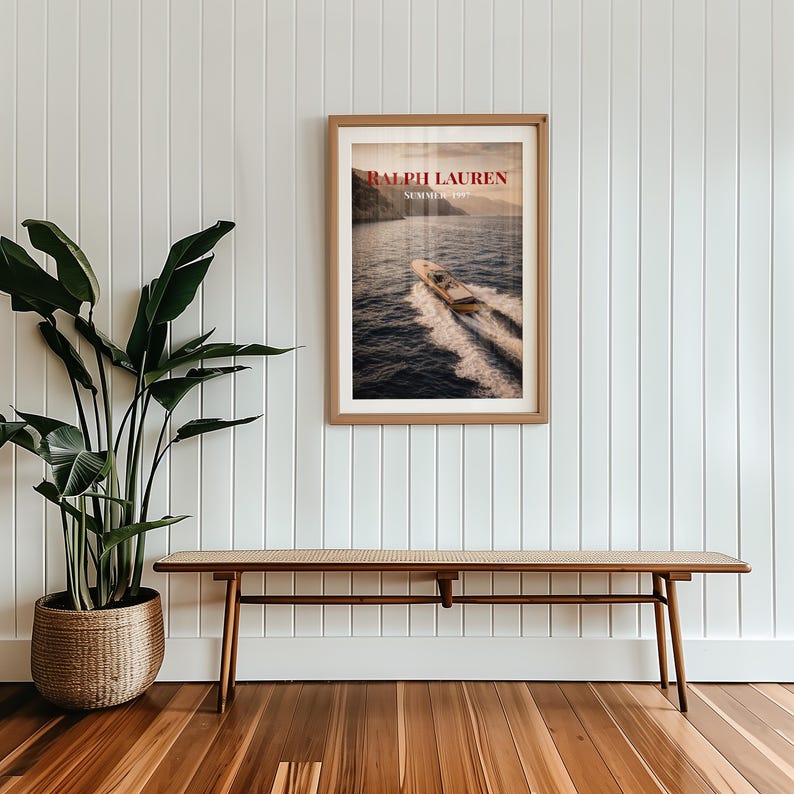 Luxury yacht speeding across the ocean at sunset with coastal mountains in the background, styled as elegant coastal lifestyle wall art.