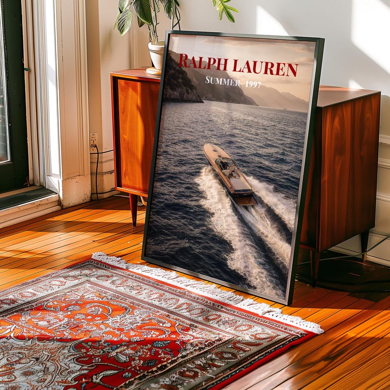 Luxury yacht speeding across the ocean at sunset with coastal mountains in the background, styled as elegant coastal lifestyle wall art.