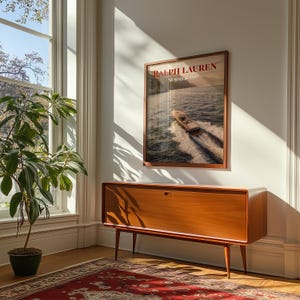 Luxury yacht speeding across the ocean at sunset with coastal mountains in the background, styled as elegant coastal lifestyle wall art.