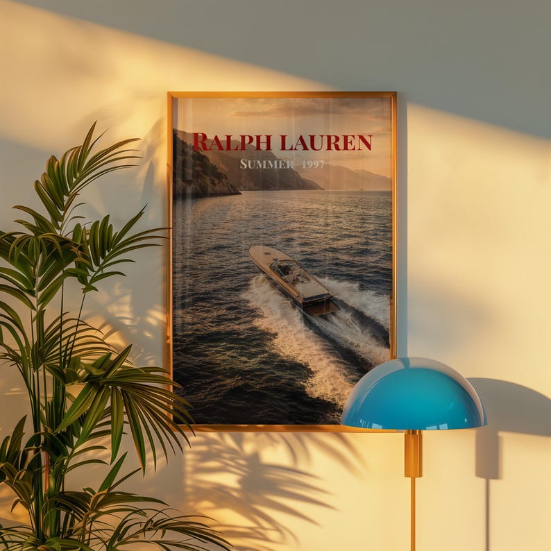 Luxury yacht speeding across the ocean at sunset with coastal mountains in the background, styled as elegant coastal lifestyle wall art.