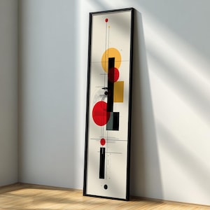 Può includere: Stampa artistica astratta in una cornice nera. L'opera presenta forme geometriche in rosso, giallo, nero e grigio su uno sfondo color crema. Il design include cerchi, quadrati e linee, creando un'estetica moderna.