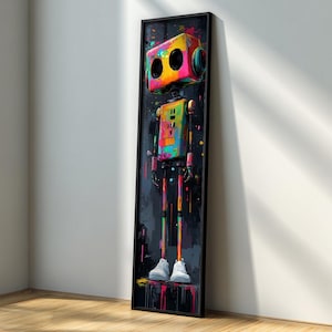 May include: A framed vertical art print featuring a colorful robot design. The robot has a box-shaped head with two large circular eyes and a rectangular body. The robot's body and legs are painted with vibrant colors, and it is wearing white sneakers. The background is dark with colorful paint splatters.