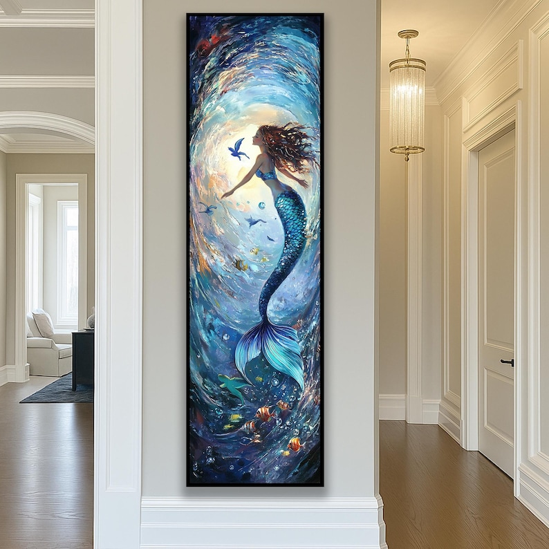 May include: A framed vertical painting of a mermaid in a swirling underwater scene. The mermaid has long brown hair, a blue top, and a turquoise tail. Fish and birds surround her in shades of blue and turquoise.