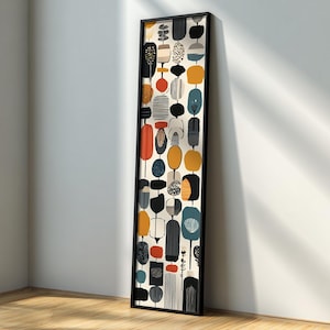 May include: A framed vertical art print featuring an abstract design of colorful, stylized shapes. The artwork includes orange, black, yellow, and blue elements against a cream background. The black frame complements the artwork's modern aesthetic.