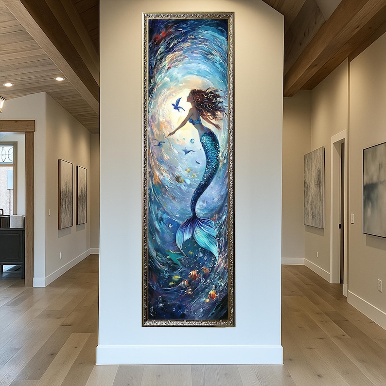 May include: A framed vertical painting of a mermaid in a swirling underwater scene. The mermaid has long flowing auburn hair, a blue top, and a turquoise tail. The artwork features fish, birds, and a bright light source.