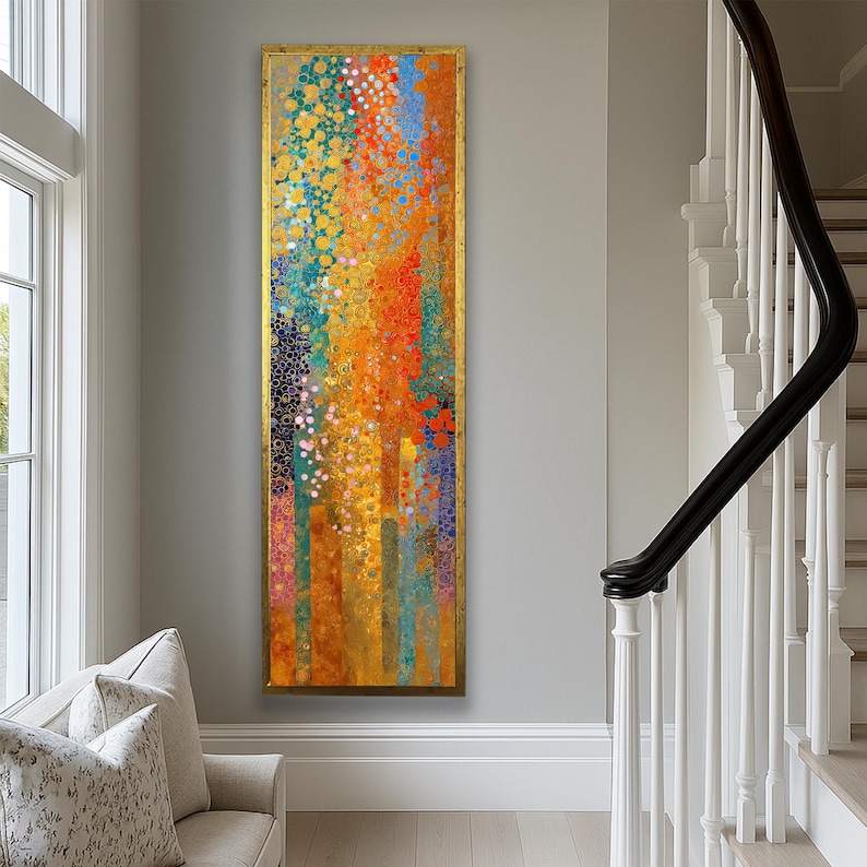 May include: Vertical abstract art piece with a gold frame. The artwork features a vibrant mix of colors, including orange, blue, and gold, with a textured appearance. The design incorporates vertical lines and circular patterns, creating a dynamic visual effect.