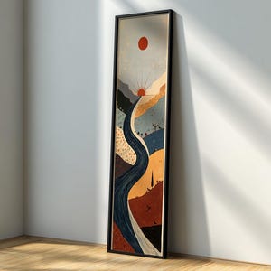 May include: A tall, rectangular framed wall art piece featuring a stylized landscape illustration. The artwork depicts a winding dark blue river flowing through layered hills in shades of orange, yellow, and blue, beneath a red sun and a pale sky.