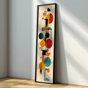 Puede incluir: Impresión artística abstracta en un marco negro. La obra presenta una composición vertical de formas geométricas coloridas, incluyendo círculos, semicírculos y rectángulos en tonos de rojo, amarillo, azul y naranja, sobre un fondo beige.