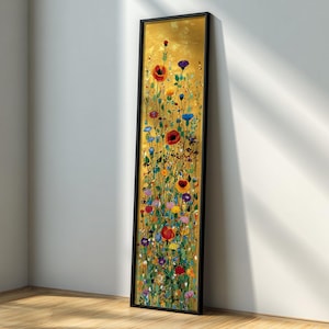 May include: A long, vertical framed artwork featuring a vibrant floral meadow against a gold background. The painting showcases a variety of colourful wildflowers, including red poppies, blue cornflowers, and purple blooms, set within a black frame.
