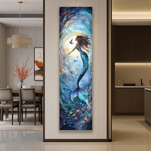 May include: A vertical canvas art piece depicting a mermaid in a swirling underwater scene. The mermaid has flowing auburn hair and a blue tail. The artwork features vibrant blues, greens, and yellows, with fish and birds adding detail.