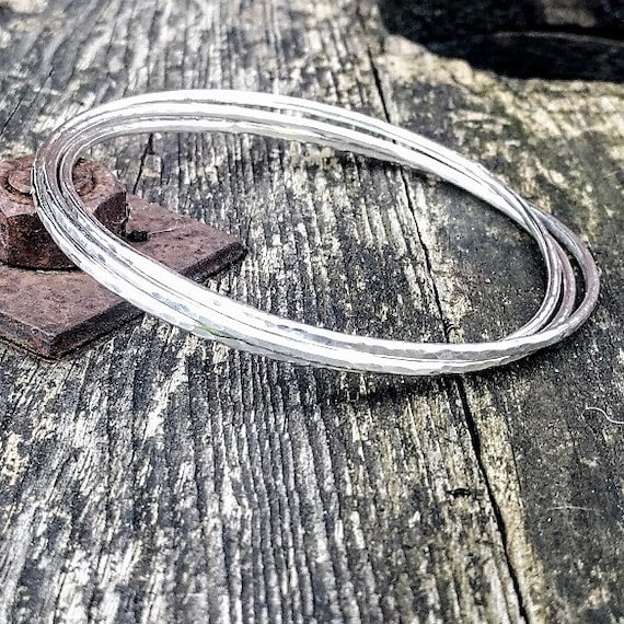 Three Solid Silver Entwined Bangles Dimpled Silver Bangle Set