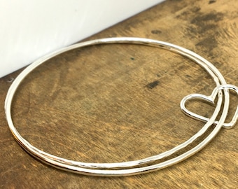 Two Silver Bangles with Heart Charm