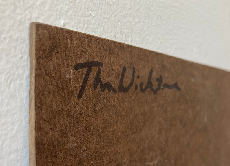 May include: A brown wooden surface with a black signature that reads "The Wichita" in cursive.
