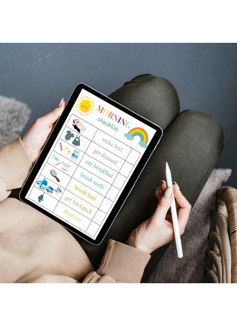 May include: A tablet displaying a colorful "MORNING checklist" with illustrations for tasks like making the bed and brushing teeth. The tablet is held by a person, along with a white stylus.