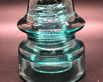 Telephone Glass Insulator Embossed No 38-20 Deep Aqua Color Insulator measures 3-3/4” tall by 3-1/4” Wide Across the Base