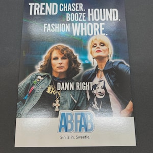 May include: A promotional card featuring two women with the text "TREND CHASER. BOOZE HOUND. FASHION WHORE." and "DAMN RIGHT." The card also displays the logo "ABFAB" and the phrase "Sin is in, Sweetie."