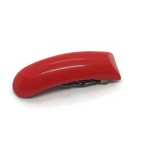 Art Deco Curved Red Plastic Dress Clip - Bakelite or Lucite ?