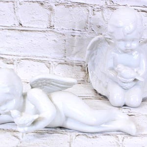 2 White Ceramic Angels Laying Down & Kneeling 1980s Vintage