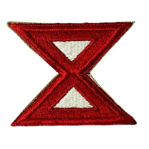 May include: Red and white embroidered patch with a stylized hourglass shape. The patch is outlined in tan.