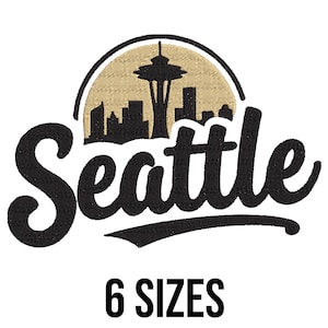May include: Black embroidered design featuring the city name "Seattle" in a script font, with an image of the Space Needle and city skyline. The design is set against a tan background and includes the text "6 SIZES" in a bold font.