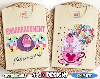 May include: Two beige t-shirts with DTF transfers featuring characters from the movie "Inside Out." One shirt displays "Embarrassment" with a character graphic. The other shows a character in a teacup with balloons. Text includes "Customizable" and "450+ Designs."