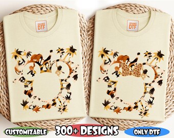 May include: Two cream-colored t-shirts with a design of a Mickey Mouse head made up of jungle animals. The text "READY TO PRESS DTF TRANSFER" is at the top of the image. The text "ORANGE DTF" is on each shirt. The text "CUSTOMIZABLE 300+ DESIGNS ONLY DTF DISNEY ANIMAL KINGDOM" is at the bottom of the image.