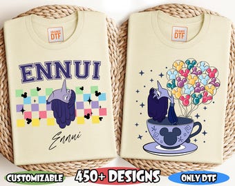 May include: Two cream-colored t-shirts with DTF transfers. One shirt features the word "ENNUI" above a cartoon character and the word "Ennui" below. The other shirt shows the same character in a teacup with Mickey Mouse balloons. Text includes "READY TO PRESS DTF TRANSFER", "CUSTOMIZABLE", "450+ DESIGNS", "ONLY DTF", and "INSIDE OUT DTF".
